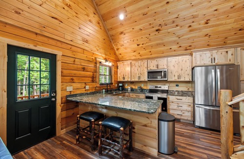 Union Hall Cabin | Stunning SML lakefront cabin: luxurious finishes, spacious rooms, wraparound deck, easy dock access. Family-friendly with toys, media room, serene views!