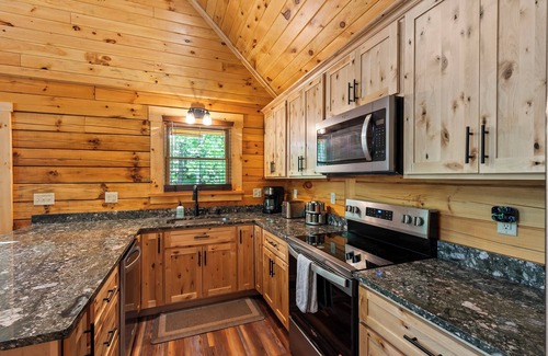 Union Hall Cabin | Stunning SML lakefront cabin: luxurious finishes, spacious rooms, wraparound deck, easy dock access. Family-friendly with toys, media room, serene views!