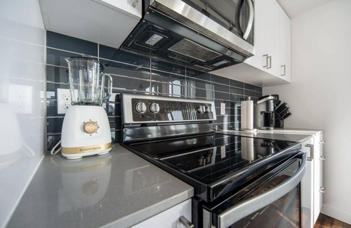 Wilburton Apartment | Stylish 2BR: City Views, Dual Workspaces & Gym Access