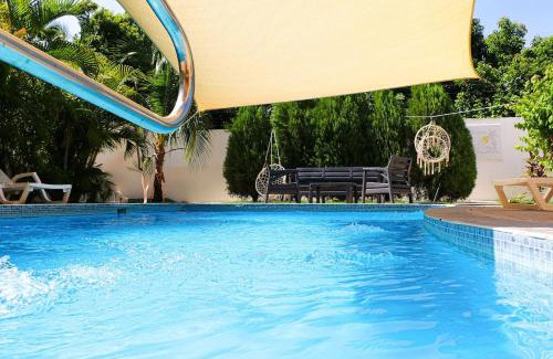 Sabana Palenque Villa | Stylish and Spacious 4BR 5BA 5 minutes from the beach