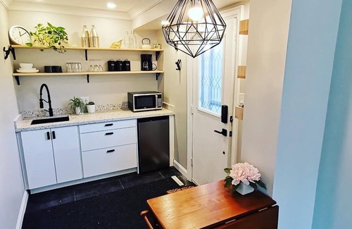 Aurora Apartment | Stylish Main Level Suite with Separate Entrance, Private Patio and 2 Car Parking