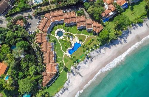 Playa Flamingo House | Stylish Split-Level Condo with a Shaded Terrace, Direct Beach Access, and Resort-Style Community Amenities