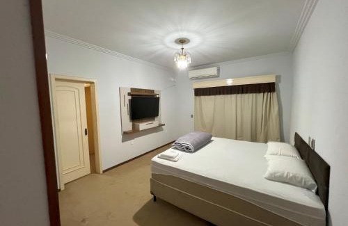 Sinop House | Suíte de luxo no centro com closet e hidromassagem