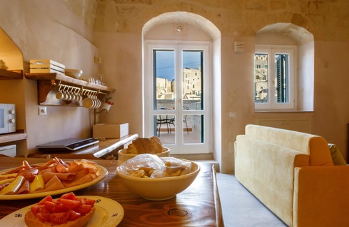 Sasso Barisano Apartment | Suite in cave with terrace and view of Sassi di Matera