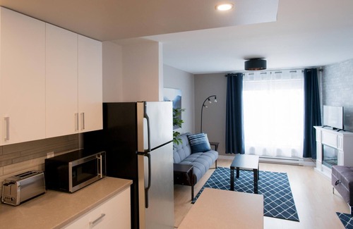Rouyn-Noranda Apartment | Suite with cloesed bedroom and sofa bed in the city center (Le Court-toit)