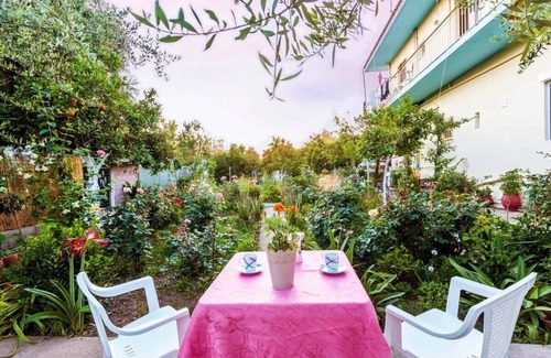 Kalamata House | Summer Rose Garden Getaway - A step to the Beach