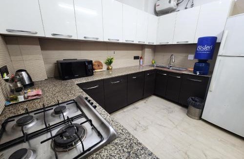 Greater Kailash Apartment | Sunlit Premium 1BHK Suite with big kitchen 9