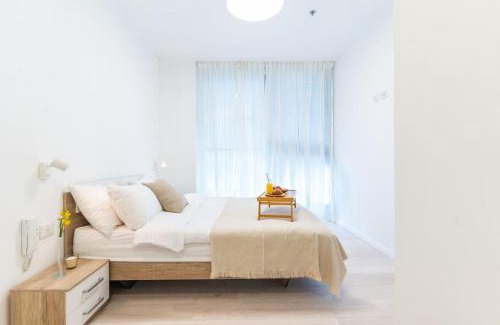 Tel Aviv Apartment | Sunlit Urban Escape with Balcony with Mamad by Sea N' Rent
