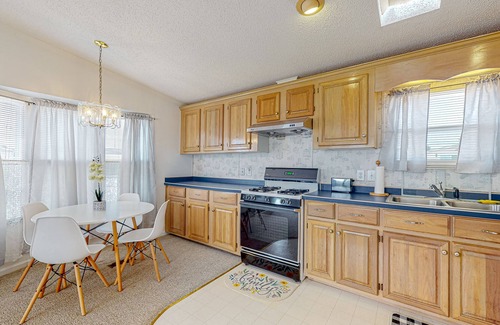 Assateague Pointe House | Sunny coastal home with private patio, on-site pool, central AC, & W/D