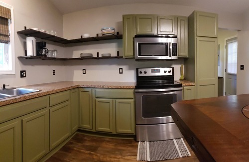 Six Lakes Cottage | Sunset Cottage: Lakefront Escape - Fenced Yard - Pet Friendly - Kayaks - Fishing