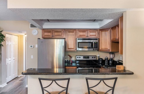Treasure Island Condo | Swaying Palm Trees; Warm Gulf Breeze