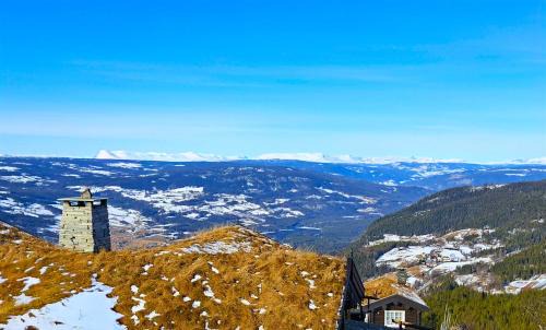 Nord-Aurdal House | Tømmerhytte i Valdres med panoramautsikt over fjellene