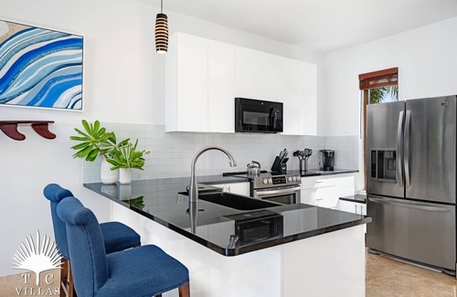 Providenciales House | TC Villas -Water Edge Villa -Beachfront on Grace Bay Beach