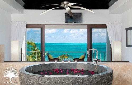 Providenciales House | TC Villas -Water Edge Villa -Beachfront on Grace Bay Beach