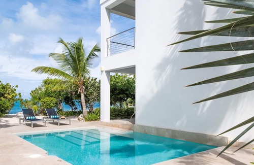 Providenciales House | TC Villas -Water Edge Villa -Beachfront on Grace Bay Beach