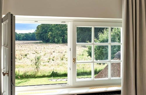 Klein Hansdorf House | Thatched-roof villa with a view of nature - 160m² of pure relaxation - sauna - g