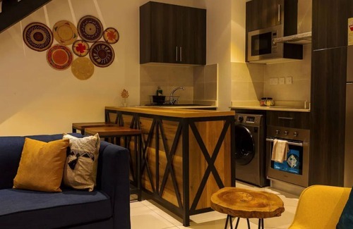 Roman Ridge Apartment | The Avery Loft at Embassy Gardens, Cantonments