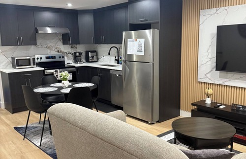 Northeast Edmonton House | The Cozy Parlor- a stylish and family-friendly space that feels just like home.