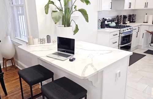 Truxton Circle Condo | The Hearth! On site parking! Minutes to restaurants, groceries and nightlife.