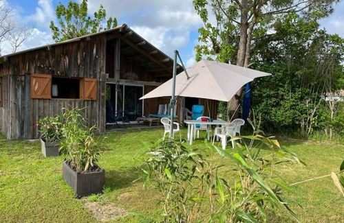 Le Porge Ski Chalet | The little blue cabin hidden in the meadow