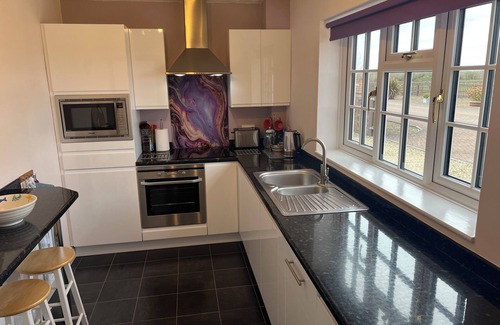 Little Somerford Cottage | The Lodge, South Cotswolds, contemporary rural home, Spa Pool, views, parking
