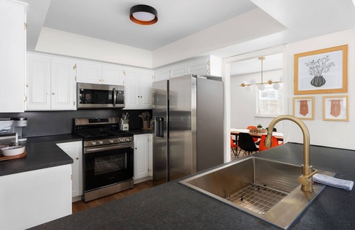 University Hills House | The Palm Royale: Mid century pool home in trendy East Austin sleeps 12!