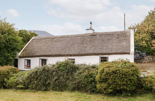 Carrowkennedy Cottage | THE THATCHED COTTAGE, pet friendly in Drummin, County Mayo