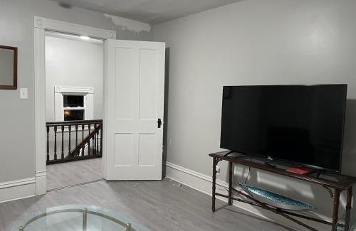 Sharon House | The Yellow-Shuttered House apt B