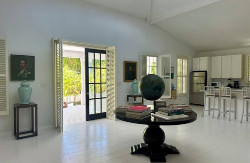 Dunmore Town Cottage | Theatrical retreat set just above Harbour Island's Pink Sand Beach, bold design meets island calm