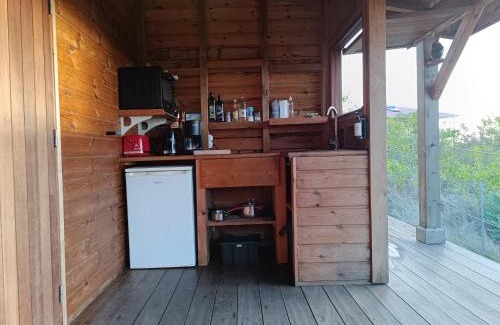 Grand Anse House | TI KAZ ANOLI Cottage en bois avec vue sur la baie