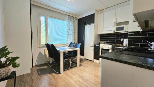 Tampere Apartment | Tilava kaksio, saunalla ja sähköauton latauksella.