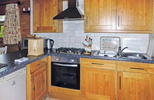 Cullompton Ski Chalet | Timber lodge with one queen size double and one twin.