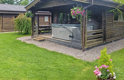 Cullompton Ski Chalet | Timber lodge with one queen size double and one twin.