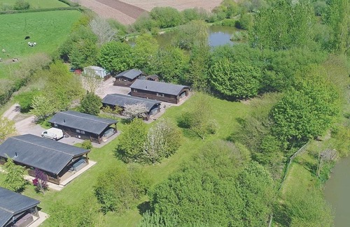 Cullompton Ski Chalet | Timber lodge with one queen size double and one twin.