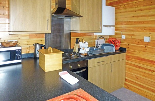 Cullompton Ski Chalet | Timber lodge with one double and one twin.