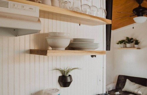 Meeker House | Tiny Home with one Queen bed and a Futon couch. Sleeps: 3