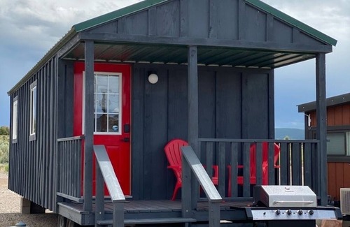 Meeker House | Tiny Home with one Queen bed and a Futon couch. Sleeps: 3