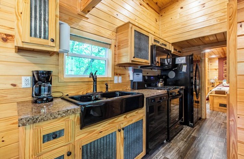 Nevis House | Tiny house nestled in the woods with lake view. Pets Accepted!
