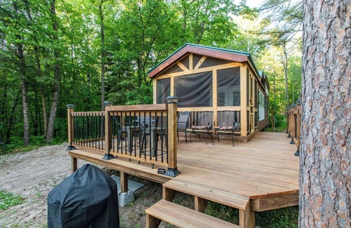 Nevis House | Tiny house nestled in the woods with lake view. Pets Accepted!