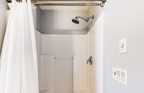 Cedar Neck House | Town of Ocean View canal-front home with dock, kayaks, balconies, grill, & AC