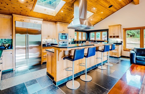 McKinleyville House | Tranquil and luxe river stay with wraparound deck, hot tub, sauna, & mtn views