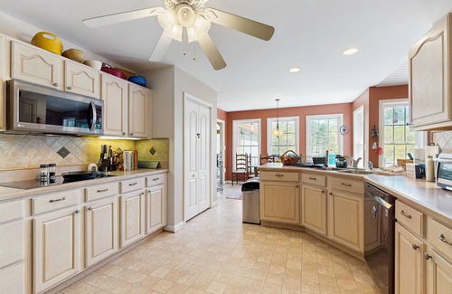 Bumpass House | Tranquil lakefront retreat with hot tub, screened porch, kayaks, and more