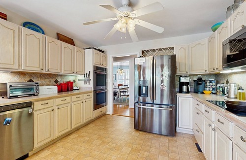 Bumpass House | Tranquil lakefront retreat with hot tub, screened porch, kayaks, and more