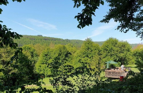 Uslar Apartment | Tree house round house, living/sleeping area - Baumhaushotel Solling