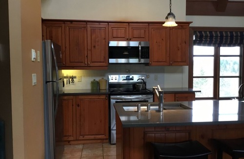 Mont-Tremblant Condo | Tremblant, on resort, sunny 4 bedroom, sleeps 8, pool, pond, 2 decks, fire pit