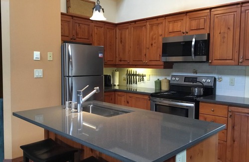 Mont-Tremblant Condo | Tremblant, on resort, sunny 4 bedroom, sleeps 8, pool, pond, 2 decks, fire pit