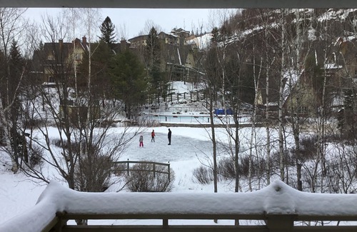Mont-Tremblant Condo | Tremblant, on resort, sunny 4 bedroom, sleeps 8, pool, pond, 2 decks, fire pit