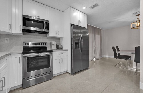 Tamarac House | Tropical Poolside Retreat in Tamarac - Lots of Activities!