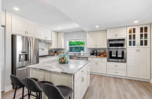 Tarpon River House | Tropical Waterfront Home - Pet Friendly & Heated Pool
