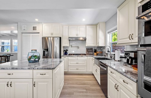 Tarpon River House | Tropical Waterfront Home - Pet Friendly & Heated Pool